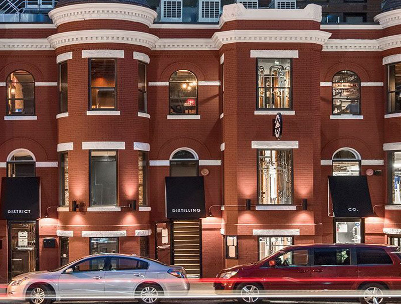 red brick building with cars