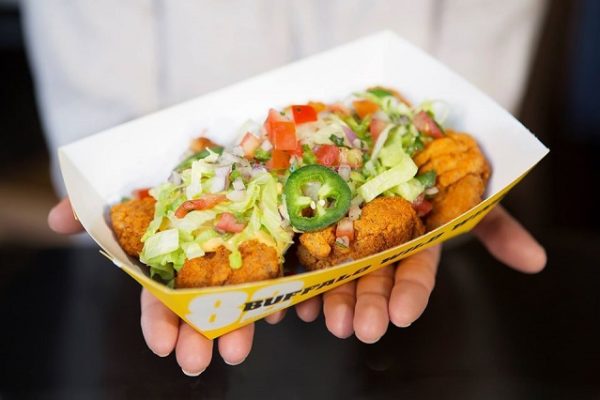 woman-holding-box-of-fried-chicken-wings