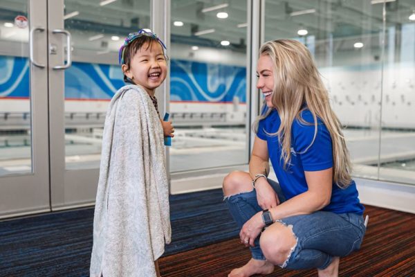 little-girl-in-a-towl-with-a-women-near-the-pool