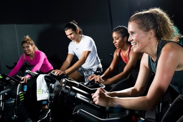 4-people-spinning-bikes