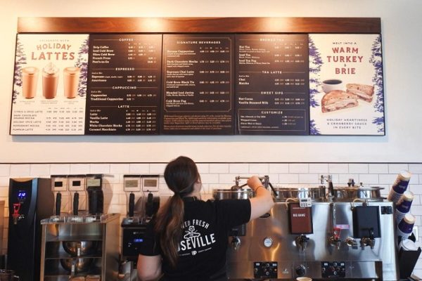 barista-pouring-coffee-menu-on-the-wall