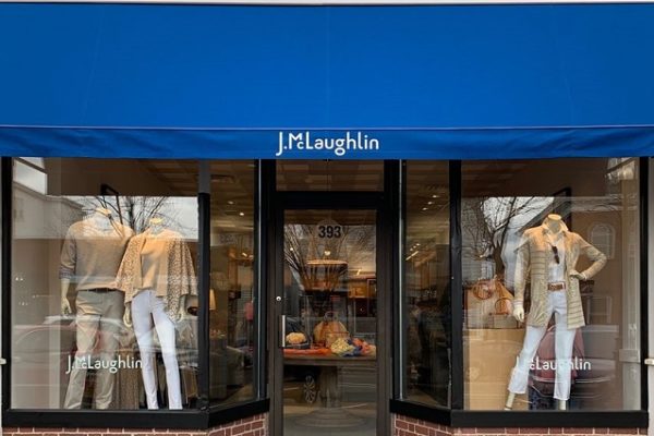 brick-storefront-with-blue-banner-and-glass-doors