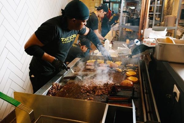 chefs-wearing-black-cooking-food