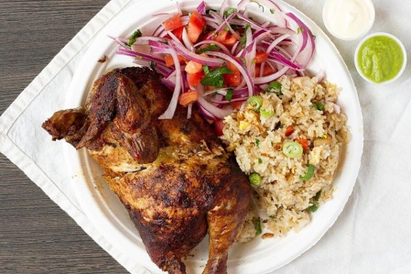 chicken-and-rice-on-white-plate-and-napkin