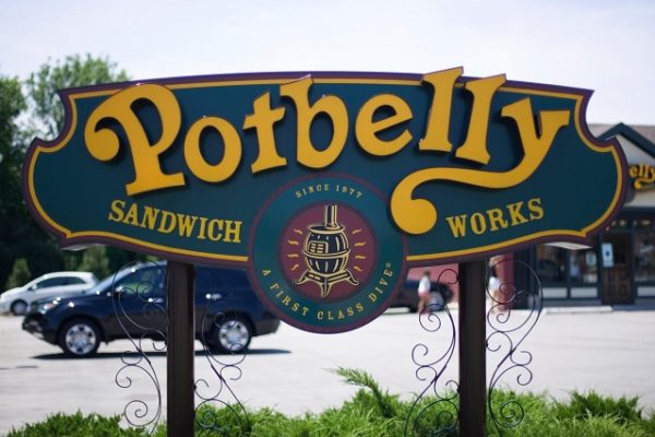 green-and-yellow-potbelly-sandwich-shop-sign-cars-in-background