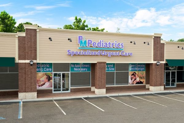 pm-pediatrics-sign-on-building-streets-blue-skies