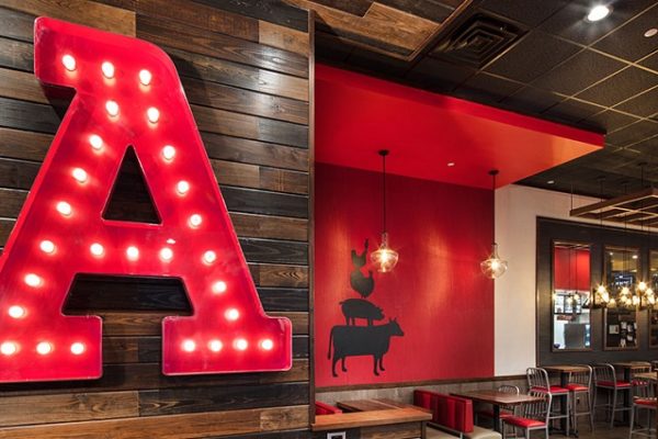 red-a-sign-on-wooden-wallwith-chairs-and-tble-restaurant