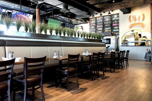 restaurant-with-wooden-floors-chairs-and-tables-and-plants