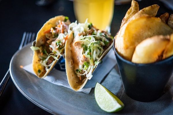 tacos-with-lime-and-fries-on-a-plate