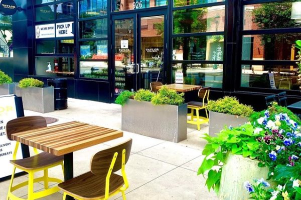 taylor-gourmet-sign-outside-building-patio-furniture-and-plants
