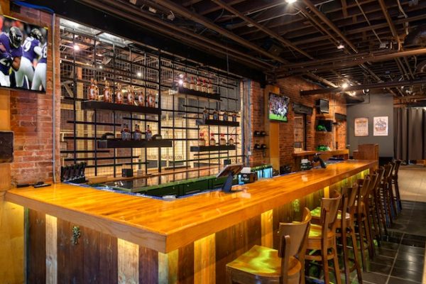 wooden-bar-with-stools-and-bottles