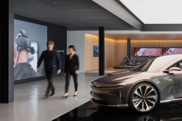 Two people walking through car store