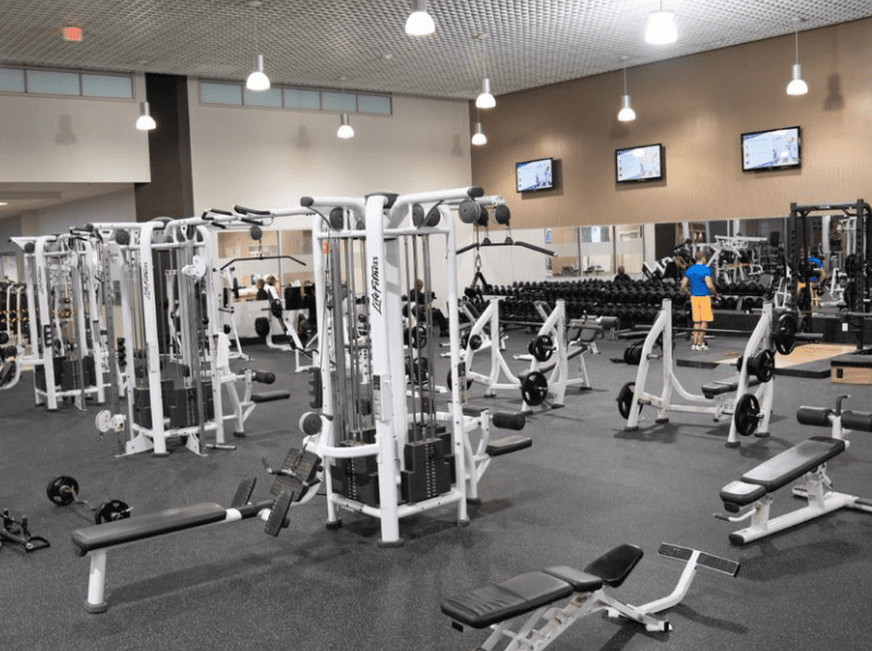 Inside gym with gym machines interior