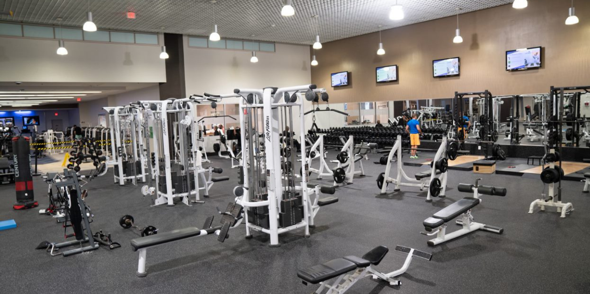 Inside gym with gym machines interior