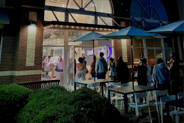 people-standing-outside-a-icecream-shop