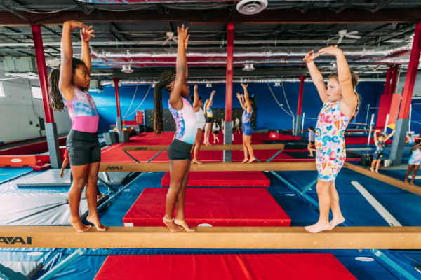 dominique_dawes_2 three little girls practicing gymnastics